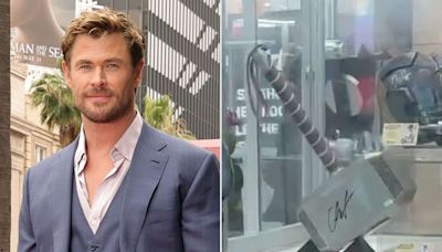 Chris Hemsworth Comes Face-to-Face with Thor's Hammer at Universal Studios: 'I Don't Remember Signing That'