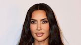 Kim Kardashian Glows In A Black Swimsuit And No Makeup As She Gets Photobombed—’Can’t A Girl Get A Good Solo...
