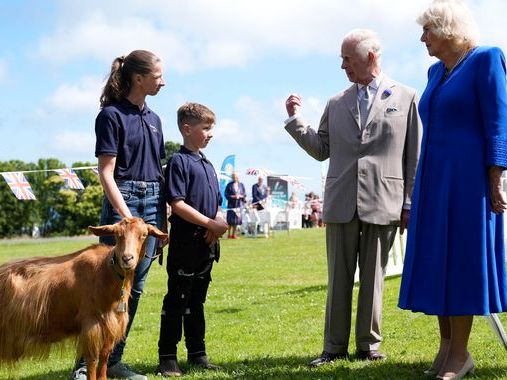 King and Queen present royal title to a goat