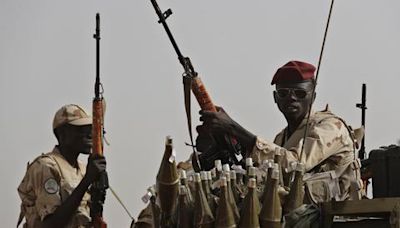 Looting and fighting reported in a central Sudan city as paramilitary group attacks military troops