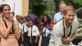 Britain's Prince Harry and his wife Meghan visit a school in Abuja to open an event on mental health for students