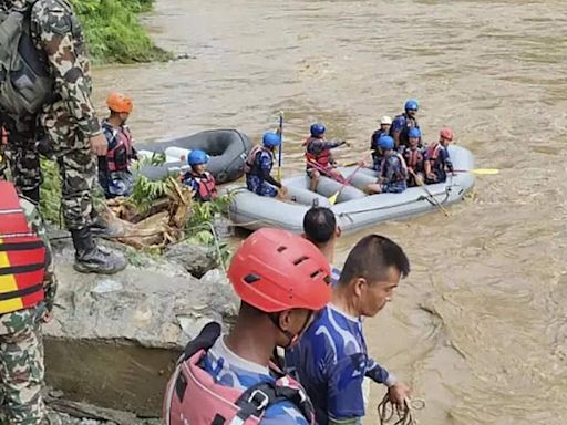 Rescuers in Nepal resume search for 51 people still missing from two buses swept away in mudslide - The Economic Times