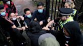 British police probe beating of protester on China consulate grounds