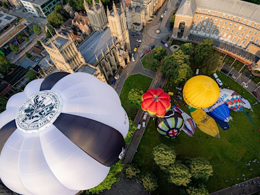 Hot air balloons take to city skies to launch annual fiesta