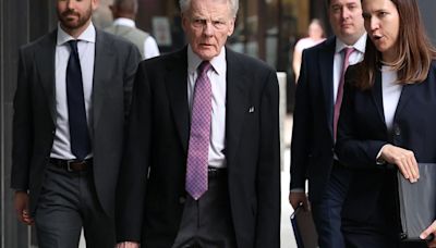Former Illinois House Speaker Michael...second from left, arrives at the Dirksen U.S. Courthouse in Chicago with his legal defense team on July 16, 2024...