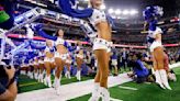 The Dallas Cowboys Cheerleaders skip onto the field during their introduction before a game against the Washington Commanders at AT&T Stadium in Arlington, Texas, on Nov. 23, 2023.