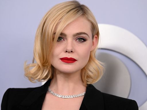 Elle Fanning's plunging suit and red lip is giving major SHE-E-O vibes