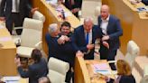 Georgian lawmakers approve a divisive foreign influence bill that has sparked weeks of protests