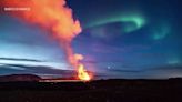 Northern lights shine during volcano eruption