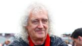 Queen's Brian May waves chequered flag at Silverstone