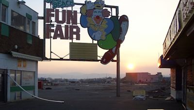 Merry-go-round & bumper cars are just rusting metal in abandoned theme park