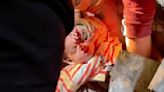 'She's alive, she's alive': Dramatic rescue of 10-month-old who survived Israeli airstrikes in Rafah that killed at least 20