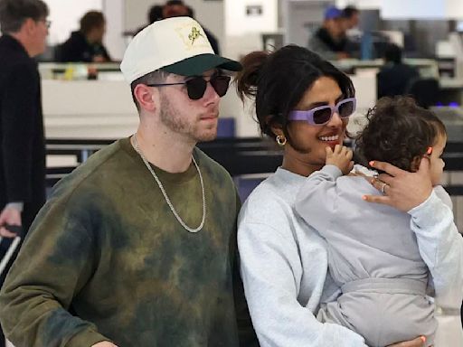 Priyanka Chopra carries daughter Malti as jets out of Australia