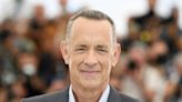 Tom Hanks yells at fans after they almost knock over his wife Rita Wilson