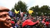 Donald Trump supporters, some wearing gas masks or riot gear, assembled on January 6, 2021, before besieging the US Capitol