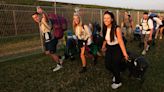 Glastonbury revellers crack open cans of cider for breakfast