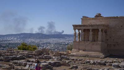Greece shuts Acropolis, 2 firefighters killed in Italy as southern Europe swelters in a heat wave