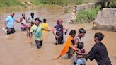 Watch: Residents of Delhi's JJ Colony walk in knee-deep water after flooding due to Munak Canal breach - CNBC TV18