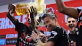 Xabi Alonso drenched in beer by players after Bayer Leverkusen wins first Bundesliga title