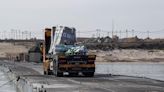 Aid for Gaza through pier paused after weather causes parts of port to detach: US official