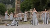 Despite weather glitch, the Paris Olympics flame is lit at the Greek cradle of ancient games