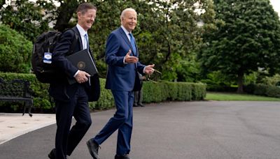 U.S. President Joe Biden accompanied by Deputy ...reacts to reporter's shouted questions as he walks to Marine One on the South Lawn of the White House...