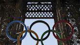 Paris Olympics organizers unveil a display of the five Olympic rings mounted on the Eiffel Tower :: WRALSportsFan.com