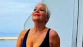 Denise Welch, 65, looks sensational in a plunging black swimsuit