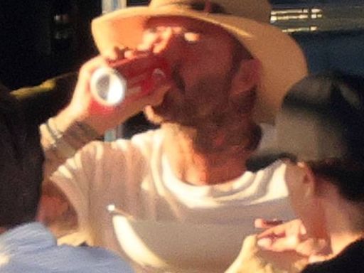 David Beckham enjoys a glass of red wine on his luxury yacht