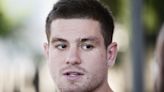 Footy star on the run from cops over domestic violence attack