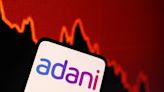 India's Adani tries to calm investors as regulator confirms probe