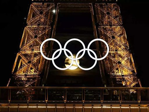 Magic in Paris: Moon perfectly nestles in Olympic rings at Eiffel Tower - Rare moment