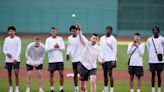 UConn’s Alex Karaban throws a strike before Red Sox host Yankees at Fenway Park