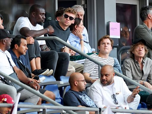 Swimming Rock Star Léon Marchand, Actual Rock Star Mick Jagger Take in Olympic Track