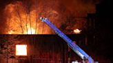 Firefighters battle large fire in former factory near downtown Akron, Howard Street closed