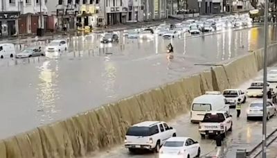 Moment cars are swept away as floods swamp Saudi Arabia & storms batter Dubai