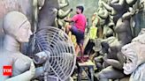Kumartuli artisans scurry for plastic cover | Kolkata News - Times of India