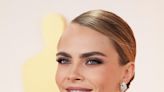 Cara Delevingne’s 2023 Oscars Hairstyle Proves the Slicked-Back Bun Is Here to Stay