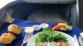 A former flight attendant shares the wild story of how she restrained an unruly passenger after a dispute over lasagna