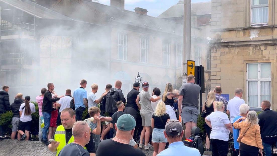 Staff describe terror as rioters attack station