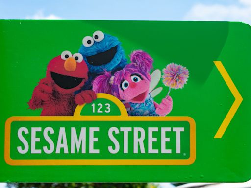 Internet Famous Corgi Meets Sesame Street’s Cookie Monster and It’s Adorable