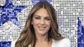 Elizabeth Hurley Turns Up the Heat in Sleek Black Bra and Chic White Robe