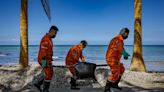 An oil spill off the Philippine coast has coated some of the world's most beautiful beaches in sludge: 'Our white sand is now black'