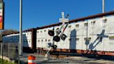 Freight train hits railroad mast arm in New Bedford