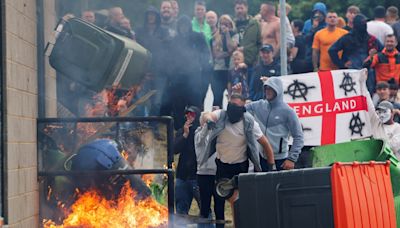Far-right rioters attack hotel housing asylum seekers in UK