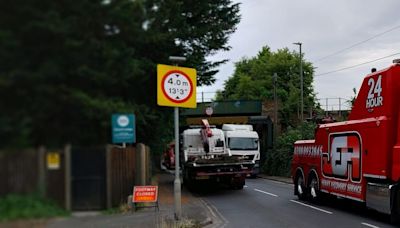 Live updates as lorry stuck under bridge in Staines leaving road shut