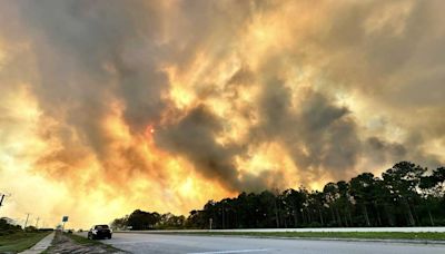 Fast-moving brush fire in Martin County forces evacuations, closes road
