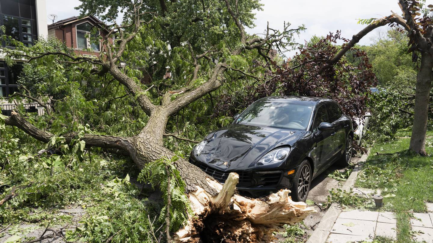 A dam fails after rain, wind, tornadoes pound the Midwest. The Chicago area is cleaning up