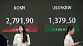 Stock market today: Asian stocks are mixed after Wall Street edges to more records