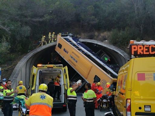 Two people trapped inside bus in Spain as dramatic pic shows flipped vehicle